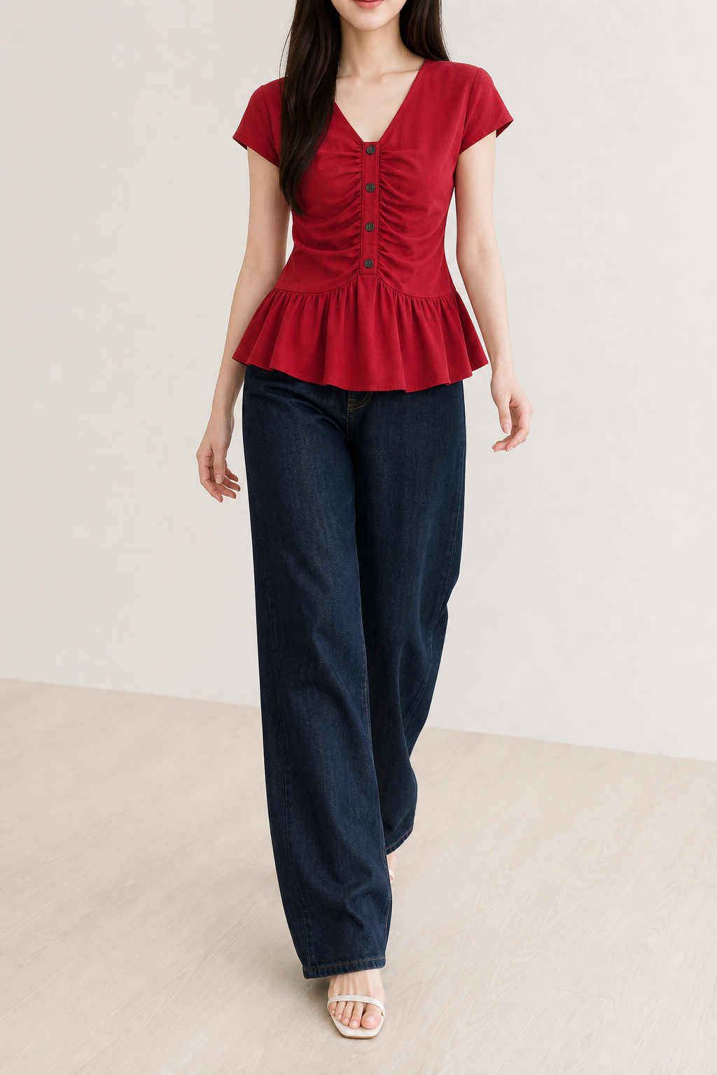 Woman in high-rise jeans with peplum top